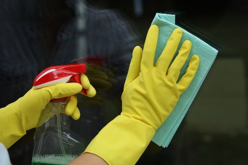 Carpet cleaning technician preparing equipment safely