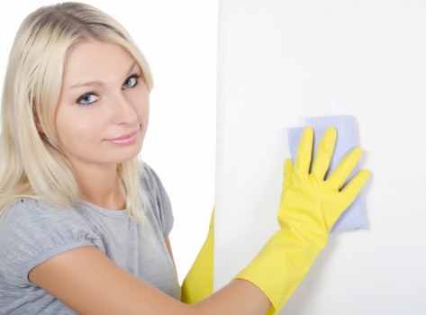 Technician handling cleaning equipment with care